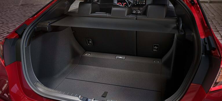 2026 Honda Civic Hatchback Sport Touring Hybrid spacious cargo area with rear seats up and cargo cover (Compact Hatchback).